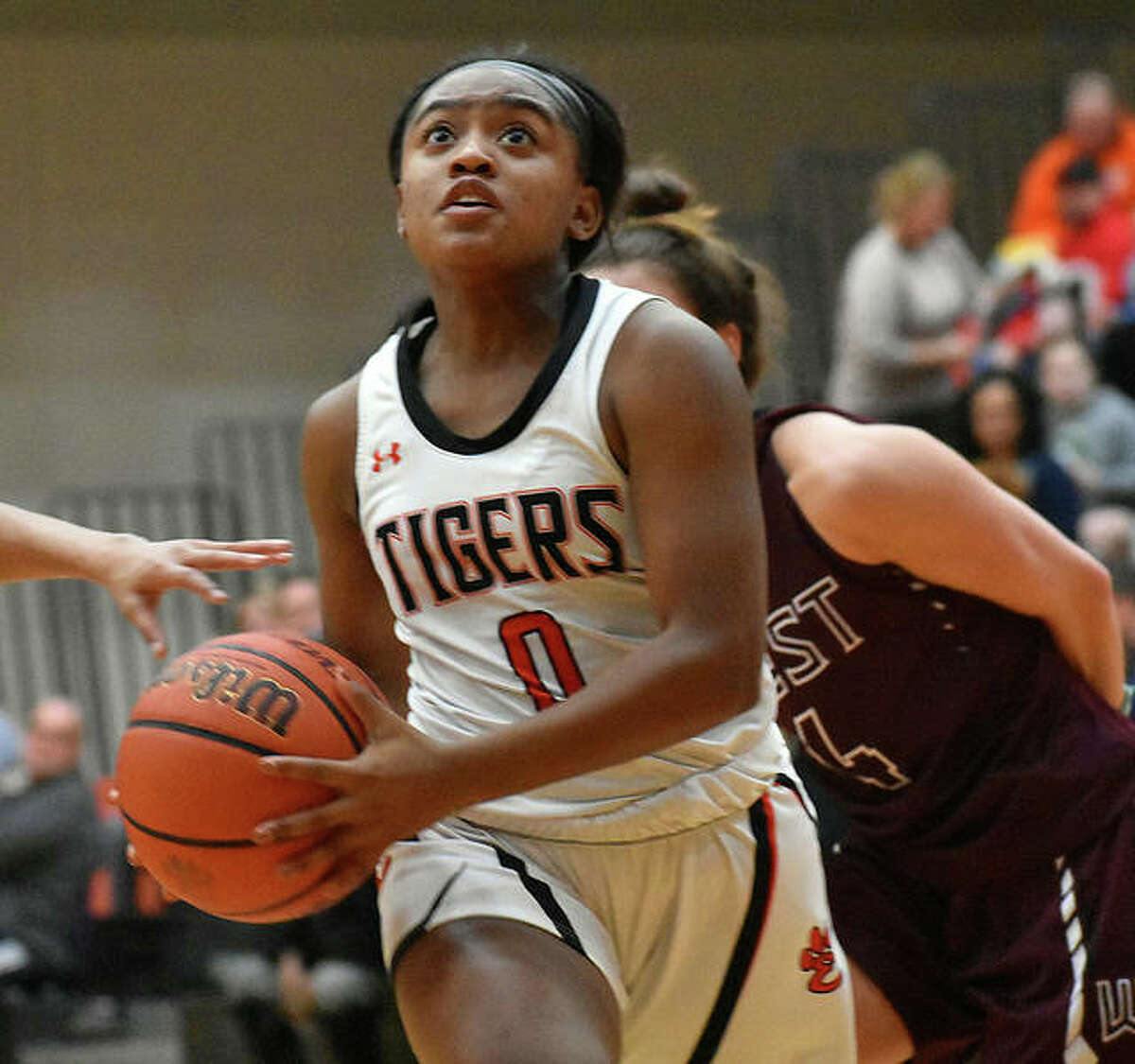 EHS senior guard Quierra Love drives to the basket in the second quarter against Belleville West on Thursday in Edwardsville.