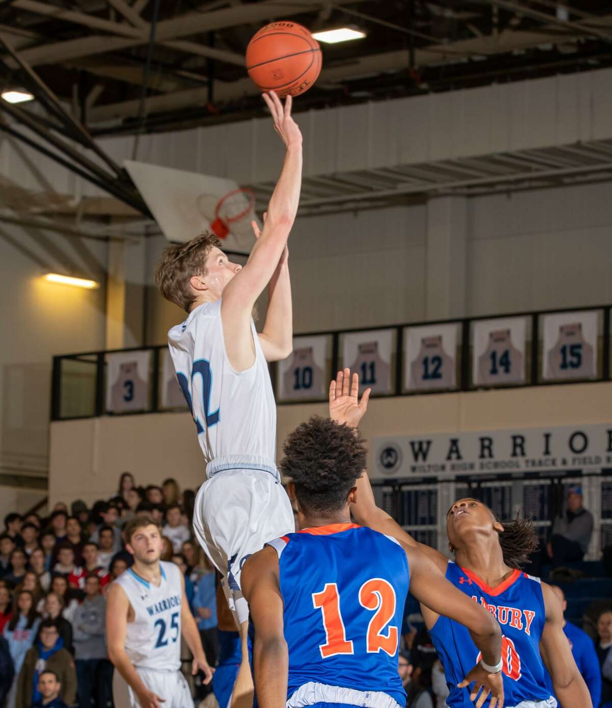 Andrew Smith rises for a jump shot during Wilton's win over Danbury on Thursday night.