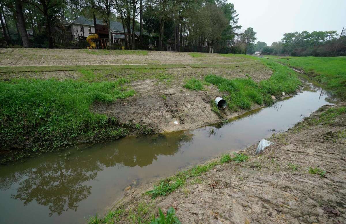 New drainage pipes along a tributary that flows into Cypress Creek are shown at Raveneaux County Club Friday, Jan. 17, 2020, in Spring. The Harris County Flood Control District bought part of the club property along Cypress Creek last week for a detention basin.