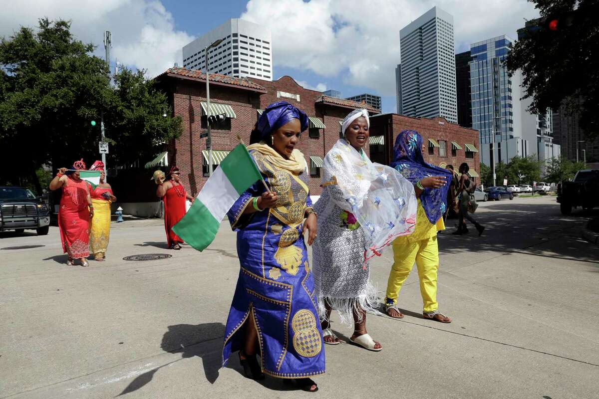 Parade participants in traditional attire during the Nigerian Cultural Festival held at in downtown Houston in September 2019. The metropolitan area is home to 35,000 Nigerians, the biggest population in the country after the New York- Newark- Jersey City area.