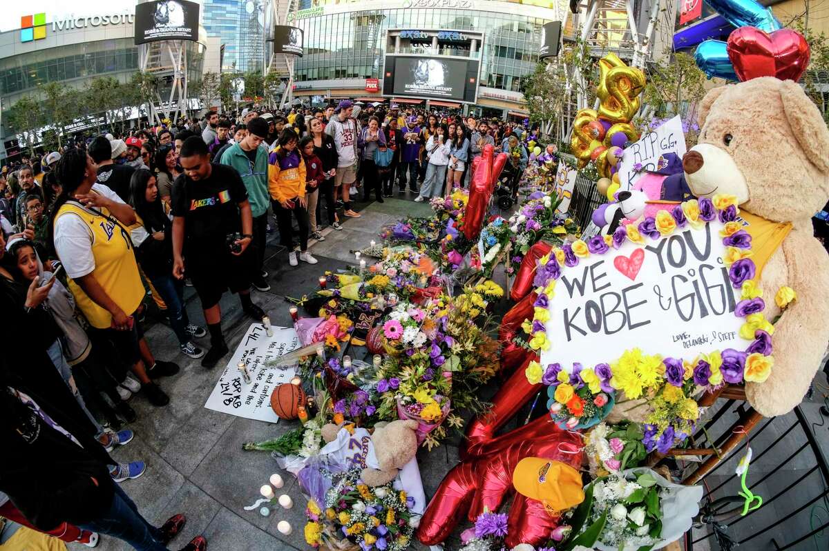 People gather at a memorial for Kobe Bryant near Staples Center last week in Los Angeles. A reader focuses on the teenagers who perished in the helicopter crash.
