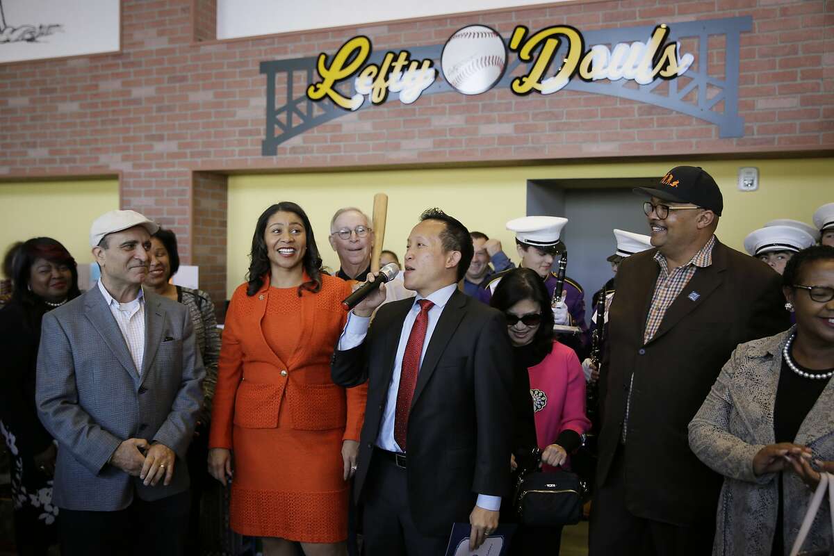 FILE - In this Nov. 20, 2018, file photo, from left, owner Nick Bovis, San Francisco Mayor London Breed, state assemblyman David Chiu speaking and city public works director Mohammed Nuru take part in the opening ceremonies of Lefty O'Doul's Baseball Ballpark Buffet & Caf� at Fisherman's Wharf in San Francisco. A top San Francisco official in charge of cleaning up the city's notoriously filthy streets and a champion of adding more portable toilets has been arrested, jail records show. Nuru was taken into custody Monday, Jan. 27, 2020, along with Bovis, the owner of Lefty O'Doul's, a longtime sports bar popular with tourists. Records say only that the men were arrested for felony safekeeping, which typically indicates federal charges. (AP Photo/Eric Risberg)