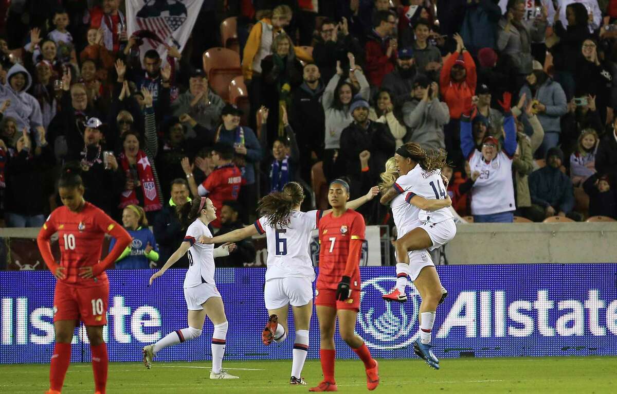 The United States forward Jessica McDonald (14) jumps into midfielder Lindsey Horan's arms to celebrate Horan's goal during the first half of the CONCACAF Women's Olympic Qualifying Tournament match against the Panama Friday, Jan. 31, 2020, at BBVA Stadium in Houston.