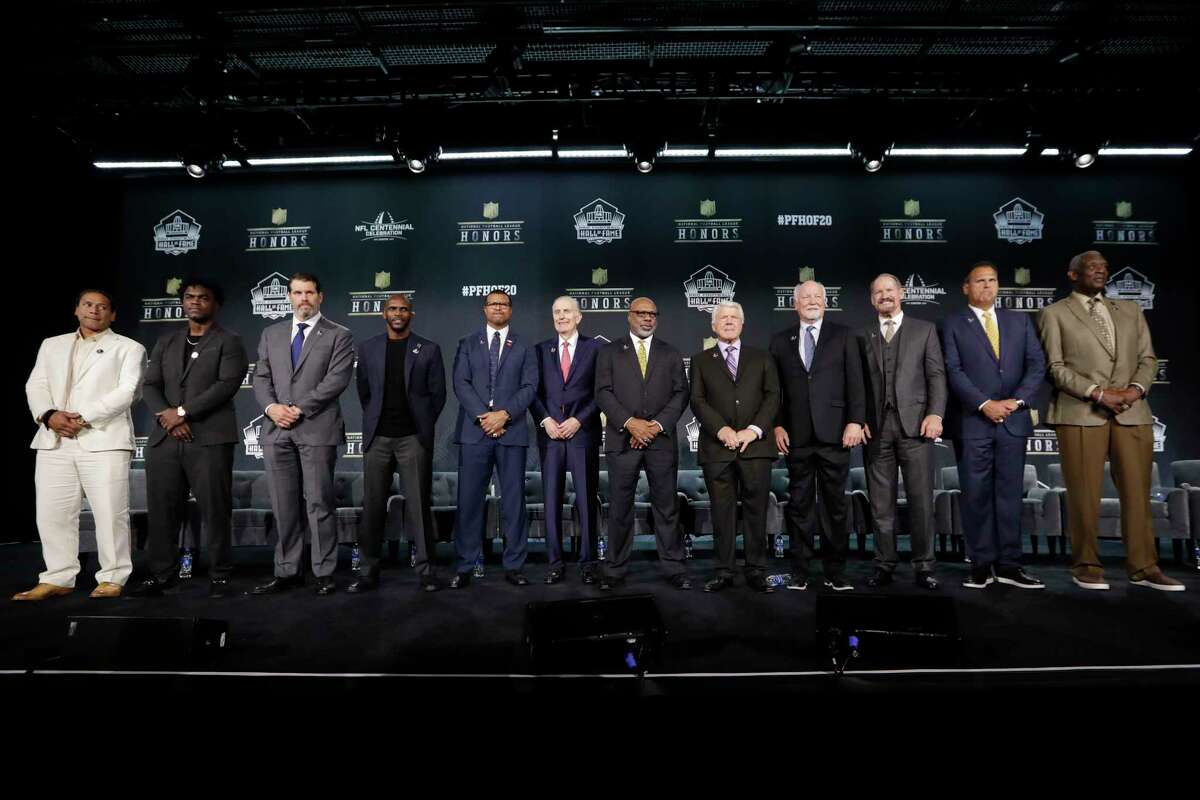 Hall of Fame Class of 2020, from left, Troy Polamalu, Edgerrin James, Steve Hutchinson, Isaac Bruce, Steve Atwater, Paul Tagliabue, Donnie Shell, Jimmie Johnson, Cliff Harris, Bill Cowher, Jimbo Covert, and Harold Carmichael pose at the NFL Honors football award show Saturday, Feb. 1, 2020, in Miami. (AP Photo/Mark Humphrey)