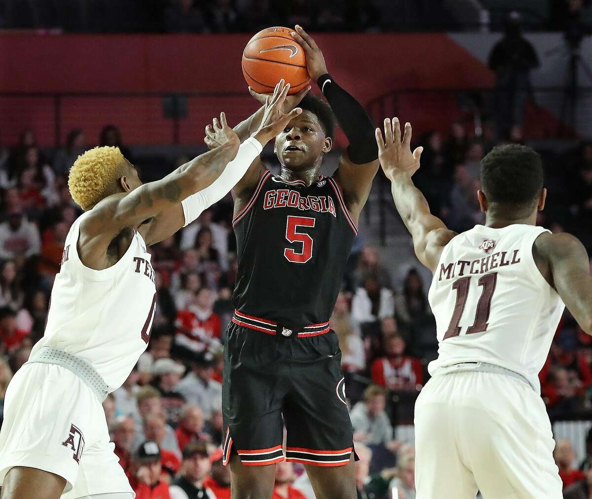 Georgia's Anthony Edwards shoots over a double-team by Texas A&M's Jay Jay Chandler, left, and Wendell Mitchell (11) during the first half on Saturday, Feb. 1, 2020, at Stegeman Coliseum in Athens, Ga. Georgia won, 63-48. (Curtis Compton/Atlanta Journal-Constitution/TNS)