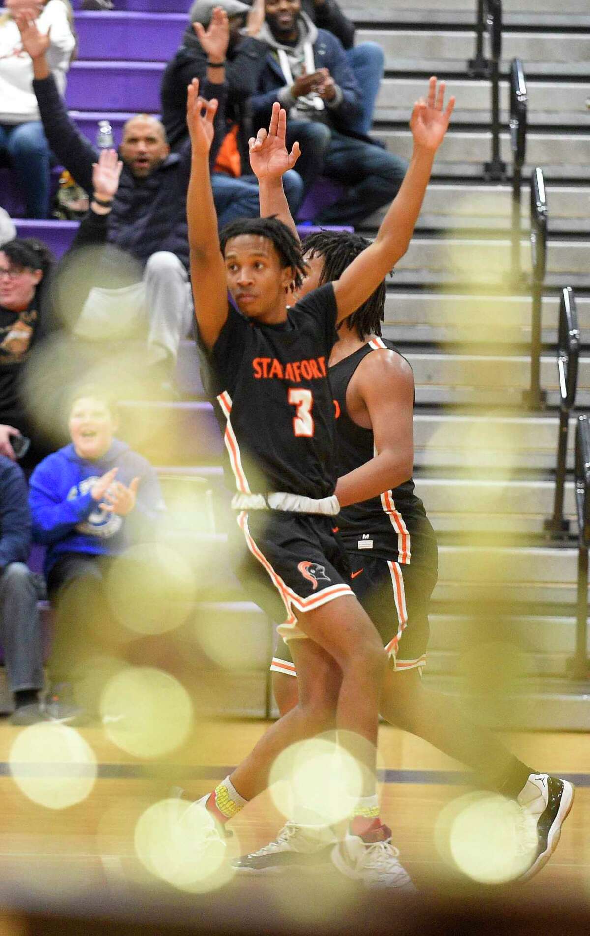 Stamford's Damani Taylor (3) celebrates his fade away three pointer in the third quarter against Westhill in a boys basketball game of the MLK Classic Basketball Tournament at Westhill High School in Stamford, Conn. on Feb. 1, 2020. Taylor shot, the turning point and go ahead basket helped Stamford defeat Westhill 57-51.