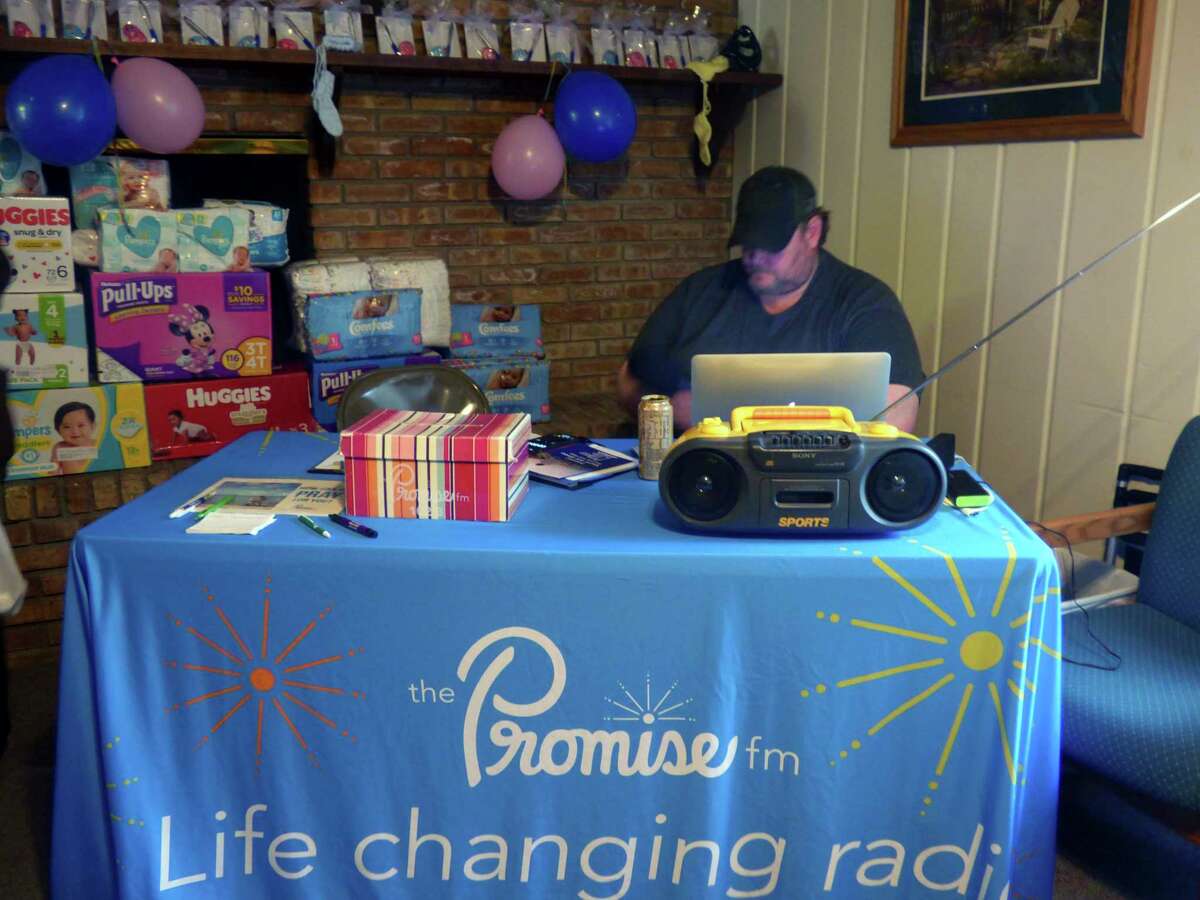 Fred Young of Promise FM, WOLM 91.1 Cadillac, broadcasts live from LPCC. (Scott Fraley/News Advocate)