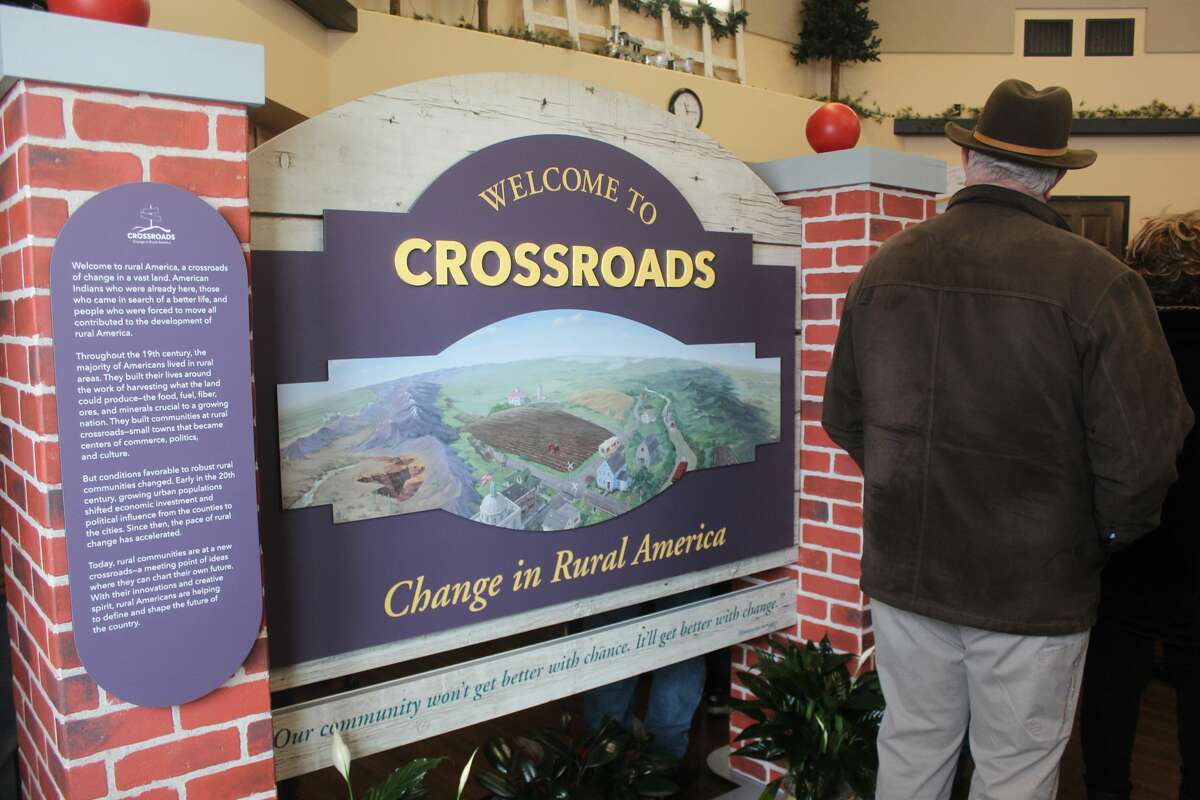 Residents and guests of Reed City attended a ribbon cutting ceremony for "Crossroads: Change in Rural America" on Saturday. The exhibit is part of the Smithsonian Museums on Main Street project and will be on display at the depot in Reed City until March 15. 