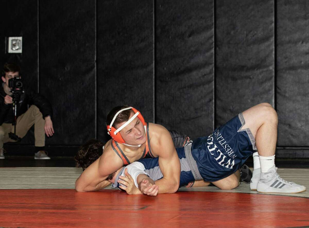 Max Alisanov (shown against Wilton earlier this season) was one of seven Ridgefield wrestlers who finished in the top four at the Lawman Invitational.