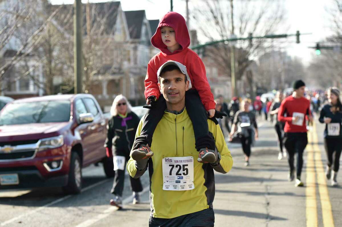 New Haven, Connecticut - February 02, 2020: Run for the Refugees 5K road race and walk Sunday morning in New Haven that benefits IRIS (Integrated Refugee and Immigrant Services), starting and ending at Wilbur Cross High School.