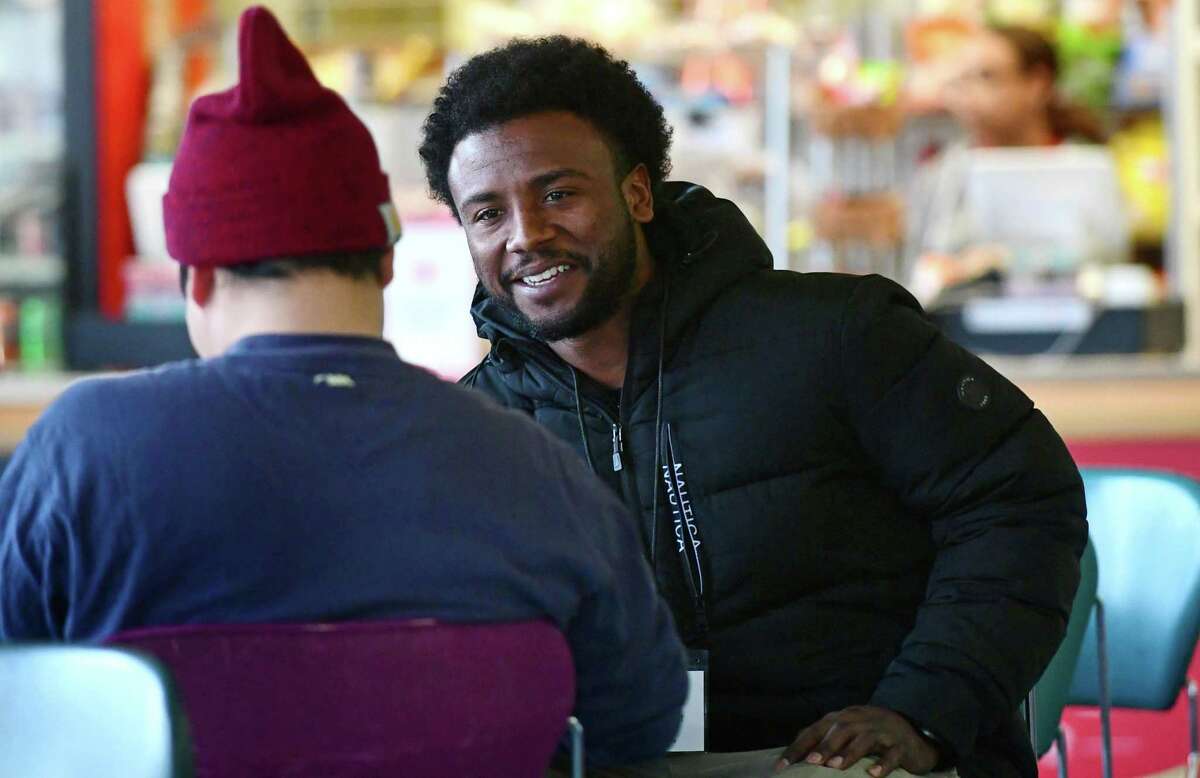 Volunteers with the Connecticut Coalition to End Homelessness including Andre McCrae ask youth to fill out a survey regarding their living situation at Norwalk Community College Tuesday, January 28, 2019, in Norwalk, Conn. The Connecticut Coalition to End Homelessness looks to quantify the problem of youth homeless in Connecticut.