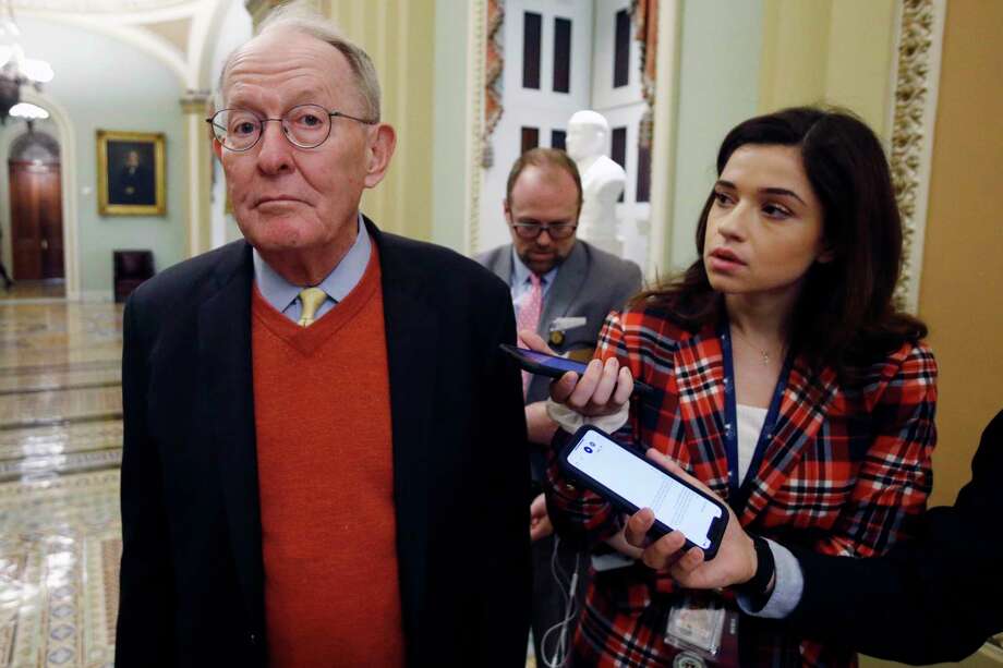 Sen. Lamar Alexander, R-Tenn., talks to reporters as he walks past the Senate chamber prior to the start of the impeachment trial of President Donald Trump at the U.S. Capitol on Friday. Photo: Steve Helber / Associated Press / Copyright 2020 The Associated Press. All rights reserved