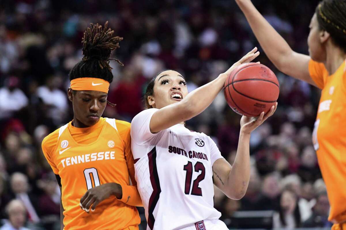 South Carolina guard Brea Beal (12) drives to the hoop against Tennessee guard Rennia Davis (0) during the first half of an NCAA college basketball game Sunday, Feb. 2, 2020, in Columbia, S.C. (AP Photo/Sean Rayford)