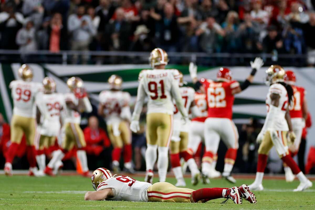 San Francisco 49ers’ Nick Bosa lies on the ground after Kansas City Chiefs’ Damien Williams scored in the fourth quarter making the score 31 to 20 clinching the win during Super Bowl LIV between the San Francisco 49ers and the Kansas City Chiefs at Hard Rock Stadium on Sunday, Feb. 2, 2020 in Miami Gardens, Fla.