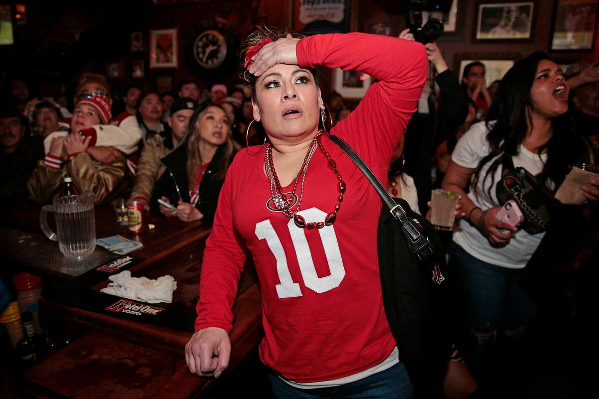 Yesenia Aviles reacts as the San Francisco 49ers lose possession in the final couple minutes against the Kansas City Chiefs during the Super Bowl LIV game on the screens at Pop�s Bar, Sunday, Feb. 2, 2020, in San Francisco, Calif. The Chiefs scores a touchdown on the next play.