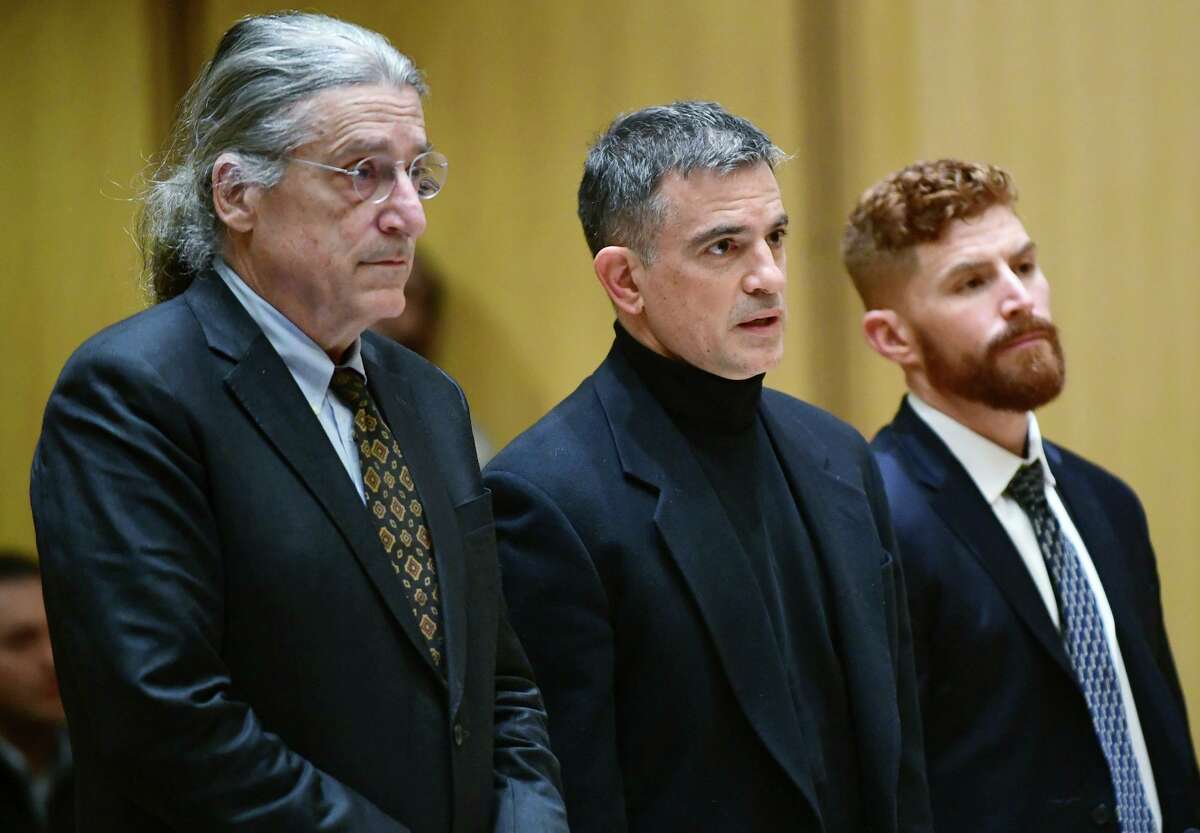Fotis Dulos, center, and his attorneys Norm Pattis, left and Chris La Tronica appear for a probable cause hearing in Stamford Superior Court, Thursday, Jan. 23, 2020, in Stamford, Conn. Dulos, the estranged husband of Jennifer Dulos, a missing Connecticut mother of five who is presumed dead, pleaded not guilty Thursday to murder and kidnapping charges as a judge warned him to not violate his house arrest conditions again. (Erik Trautmann/Hearst Connecticut Media via AP, Pool)