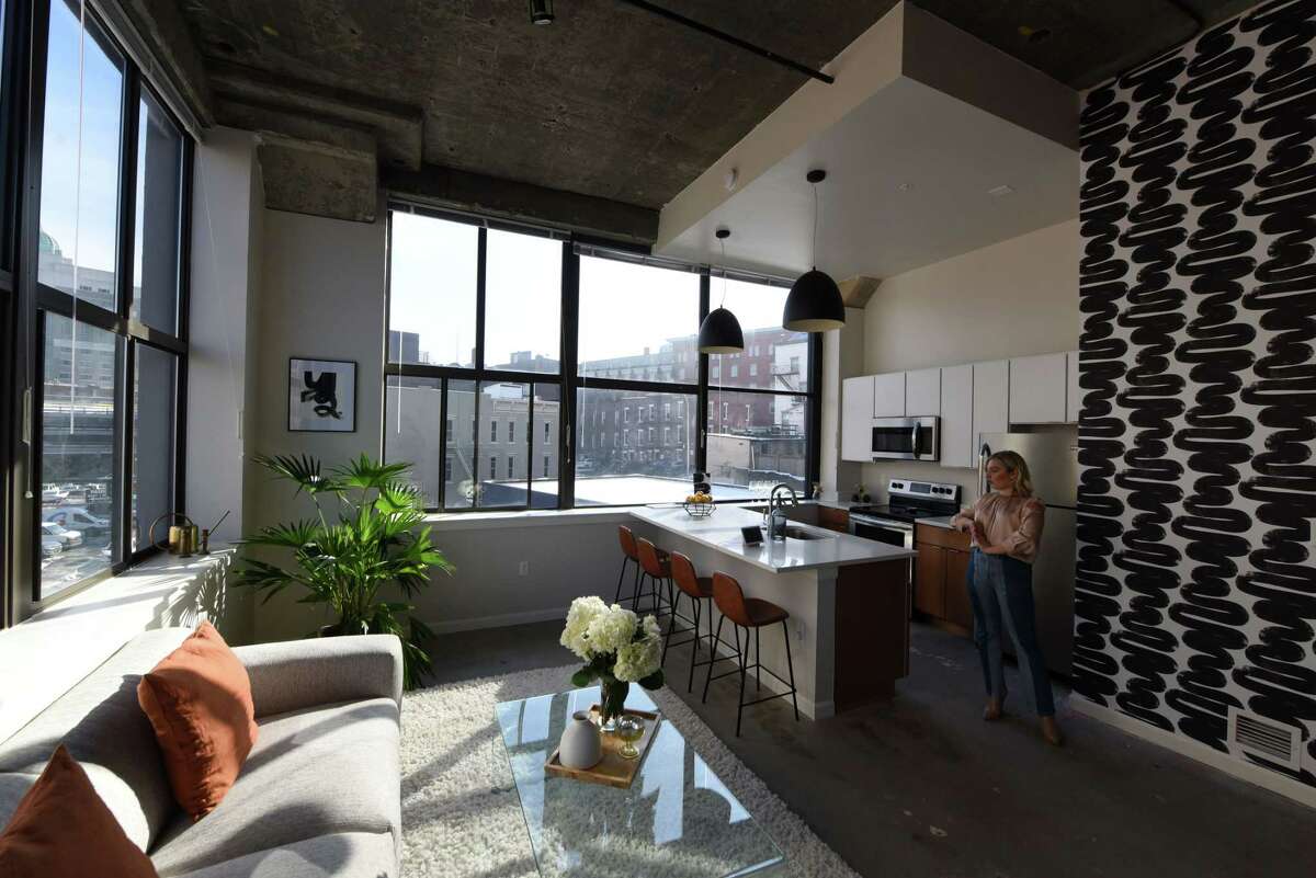 Living and dining space inside Taylor Rao's new apartment at The Knick on Friday, Jan. 24, 2020, in Albany, N.Y. Rao decorated her downtown dwelling. (Will Waldron/Times Union)