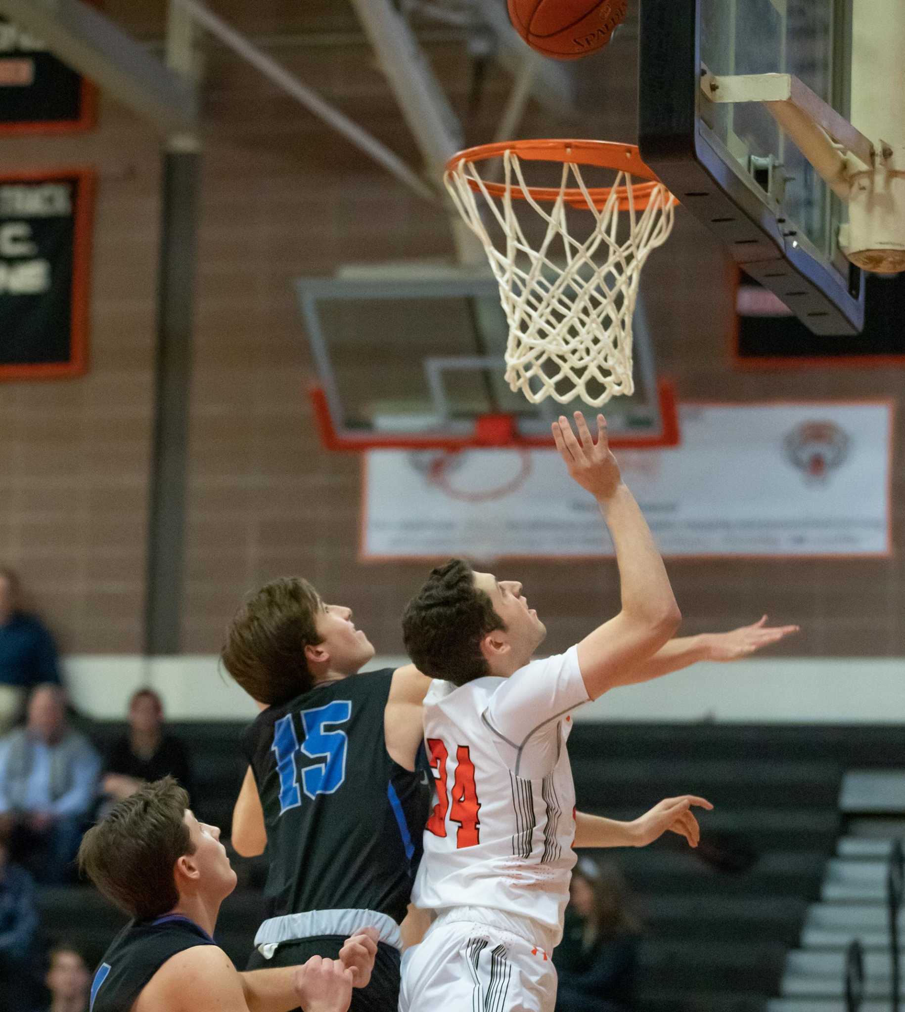 Ridgefield hoop teams sweep New Canaan