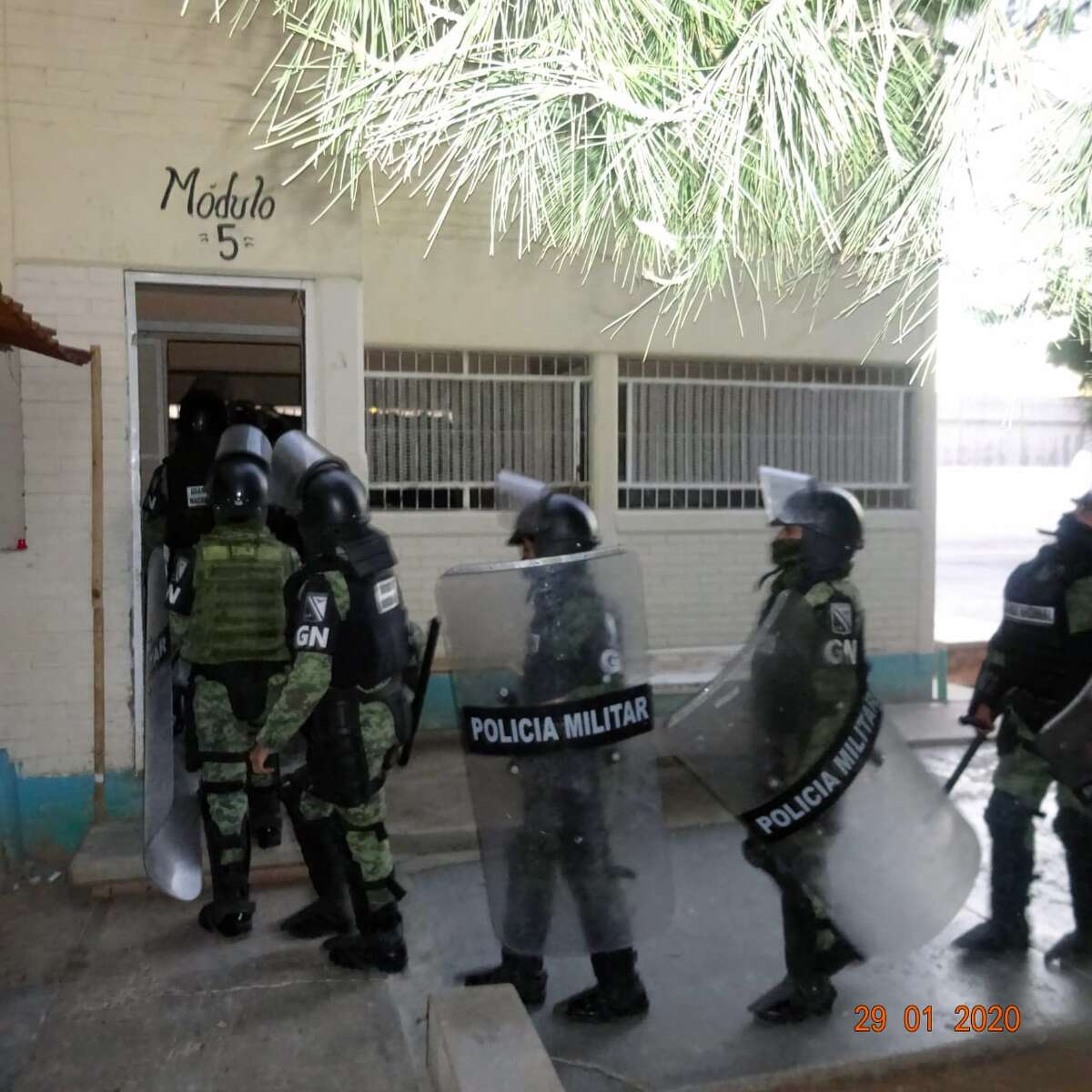 Mexican National Guard soldiers in tactical gear are seen inspecting an area of the prison in Nuevo Laredo.