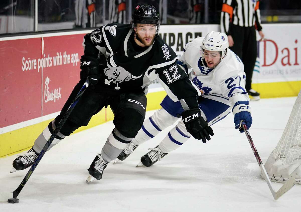 A combination of hustle and skill makes Nathan Walker, left, one of the Rampage’s best forwards despite standing just 5-foot-8.