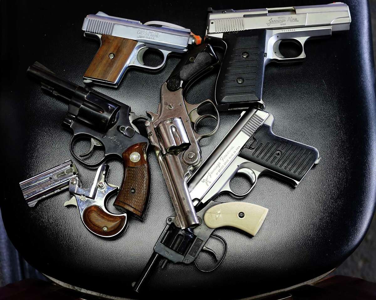 A detail view of pistols that were turned in during a gun buy back program in 2013.