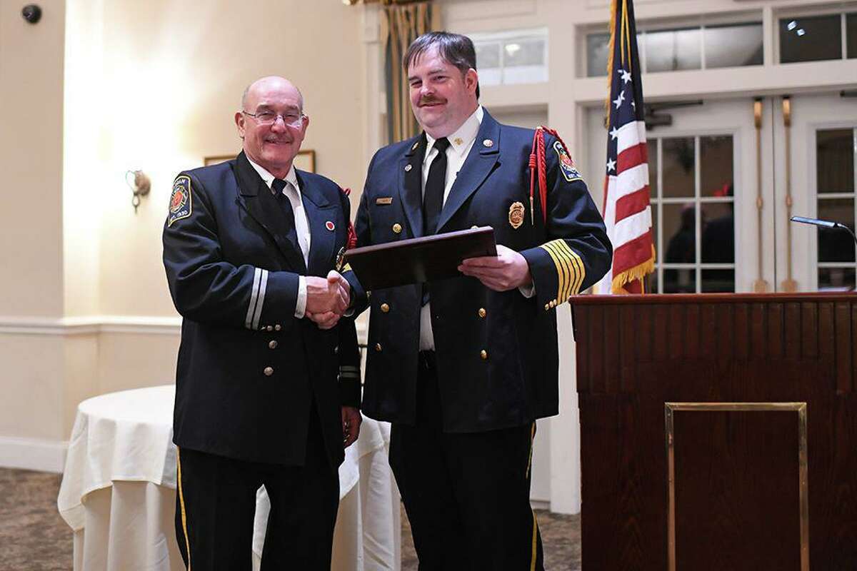 Higganum resident Richard Zanelli, left, was named the 2019 Firefighter of the Year during Haddam Volunteer Fire Company’s Firefighters’ Appreciation Banquet Feb. 1. At right is Fire Chief Sam Baber.