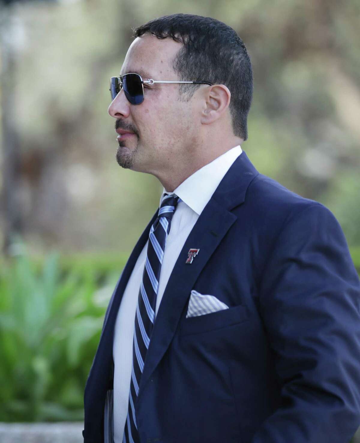 Brian Alfaro, who faces seven counts of mail fraud in connection with allegedly defrauding investors in the sale of units in oil and gas wells, arrives at the John H. Wood Jr. U.S. District Courthouse.
