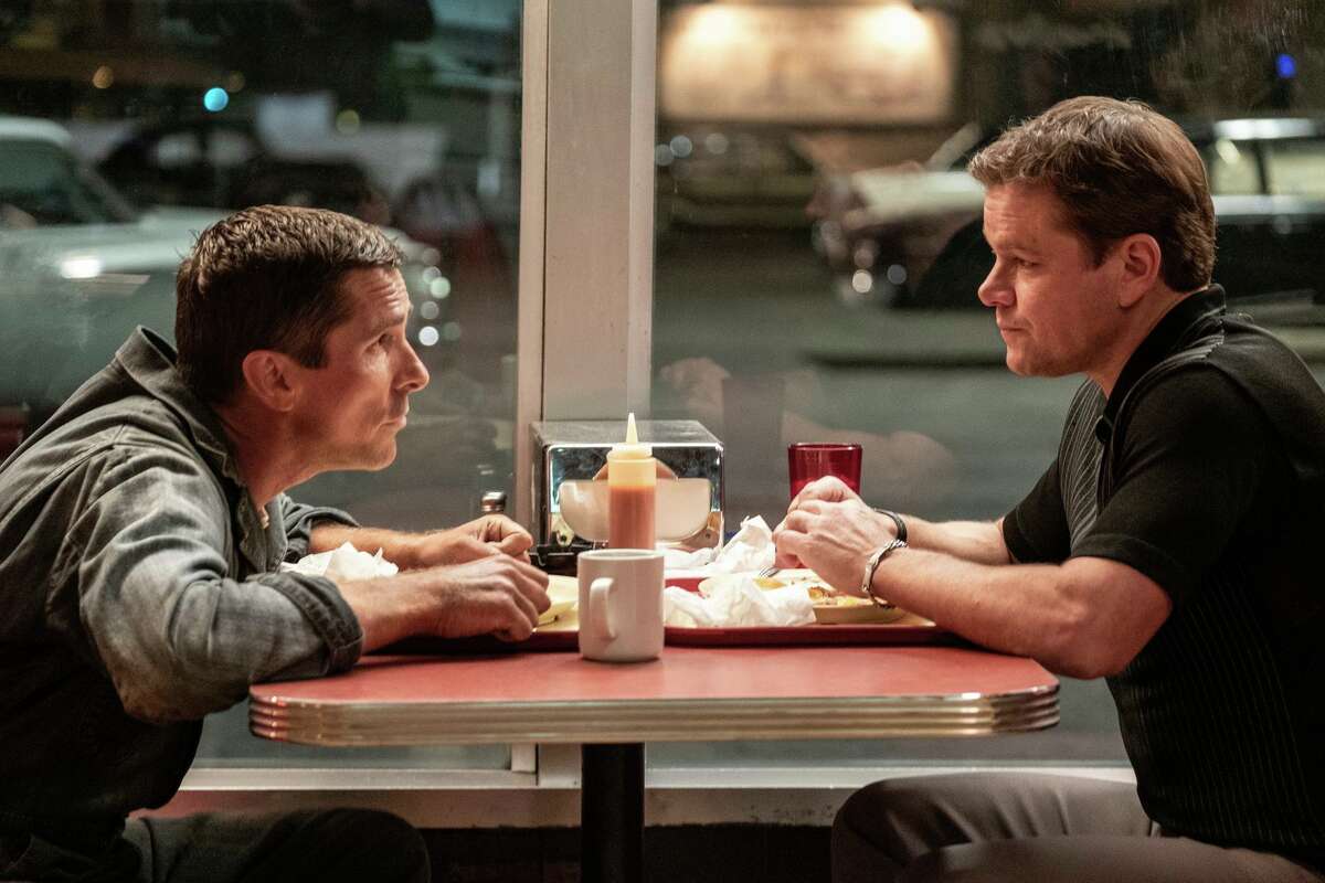 Christian Bale, left, and Matt Damon in a scene from "Ford v. Ferrari."