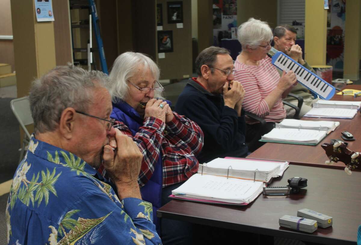 Members of Harmonicas in Class — a local group who play harmonica, hammered dulcimer, banjo, guitar and melodica — gathered Tuesday morning at Artworks to play a variety of tunes as part of the annual Festival of the Arts.