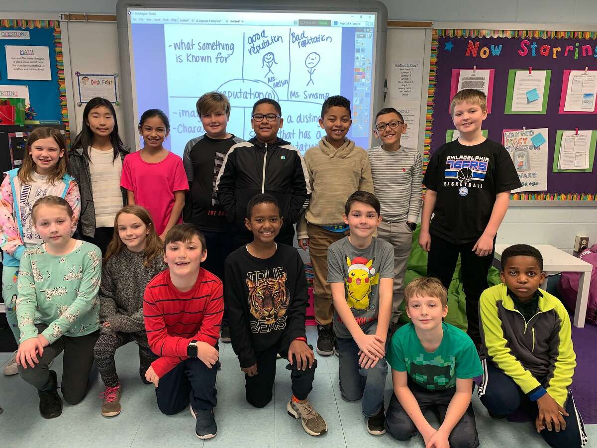 Long Hill School fourth graders after working on a vocabulary program. The school was recently tabbed by the state as a School of Distinction.