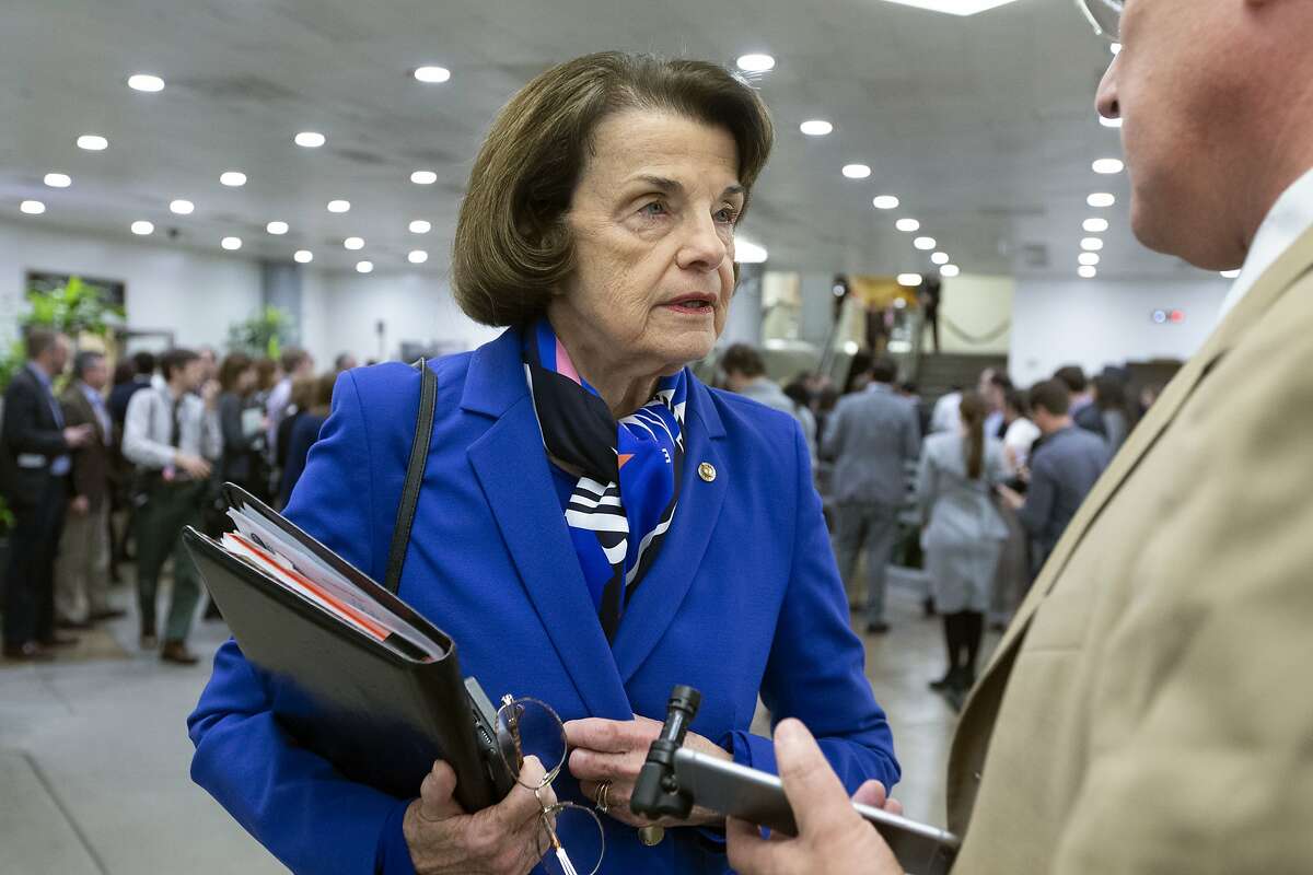 Sen. Dianne Feinstein, D-Calif., talks to reporters as she walks to her office during the impeachment trial of President Donald Trump on charges of abuse of power and obstruction of Congress, on Capitol Hill in Washington, Monday, Feb. 3, 2020. (AP Photo/Jose Luis Magana)