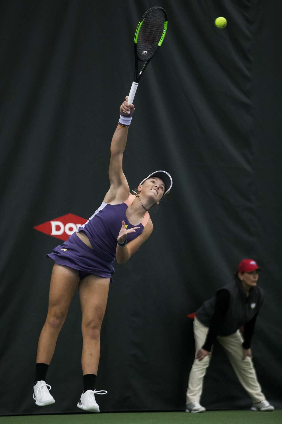 Ellie Coleman of Midland serves the ball in a match against Yanina Wickmayer of Belgium during the Dow Tennis Classic Tuesday, Feb. 4, 2020. (Katy Kildee/kkildee@mdn.net)
