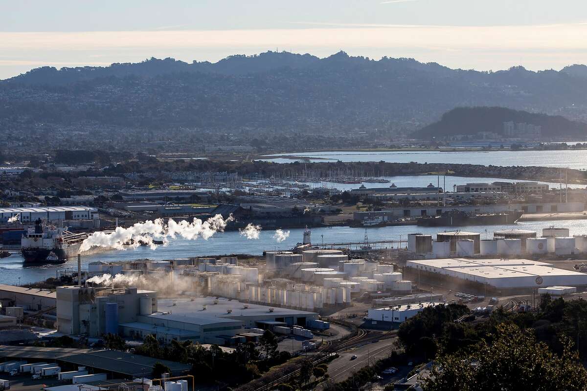 Steam from the Kinder Morgan chemical plant rises into the morning sky seen from above in Richmond, Calif. Tuesday, February 4, 2020. The Ninth Circuit Court of Appeals is scheduled Wednesday, February 5 to hear arguments from three counties and five cities, including San Francisco and Oakland, on why their groundbreaking climate lawsuits should proceed in state court rather than federal court.