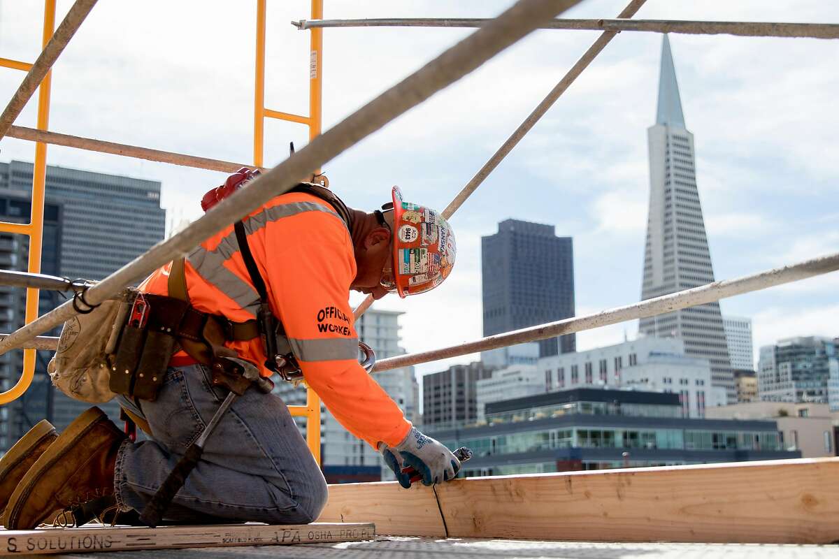 Workers continue construction on two affordable housing developments, one for seniors and one for multi-family use, along the Embarcadero near Broadway in San Francisco, Calif. Tuesday, February 4, 2020. San Francisco Mayor London Breed is planning to spearhead a signature-gathering effort to put a measure on the November 2020 ballot that will make 100% affordable housing developments easier to build. This measure would also confer streamlining benefits to market-rate housing projects that exceed their affordability requirements.