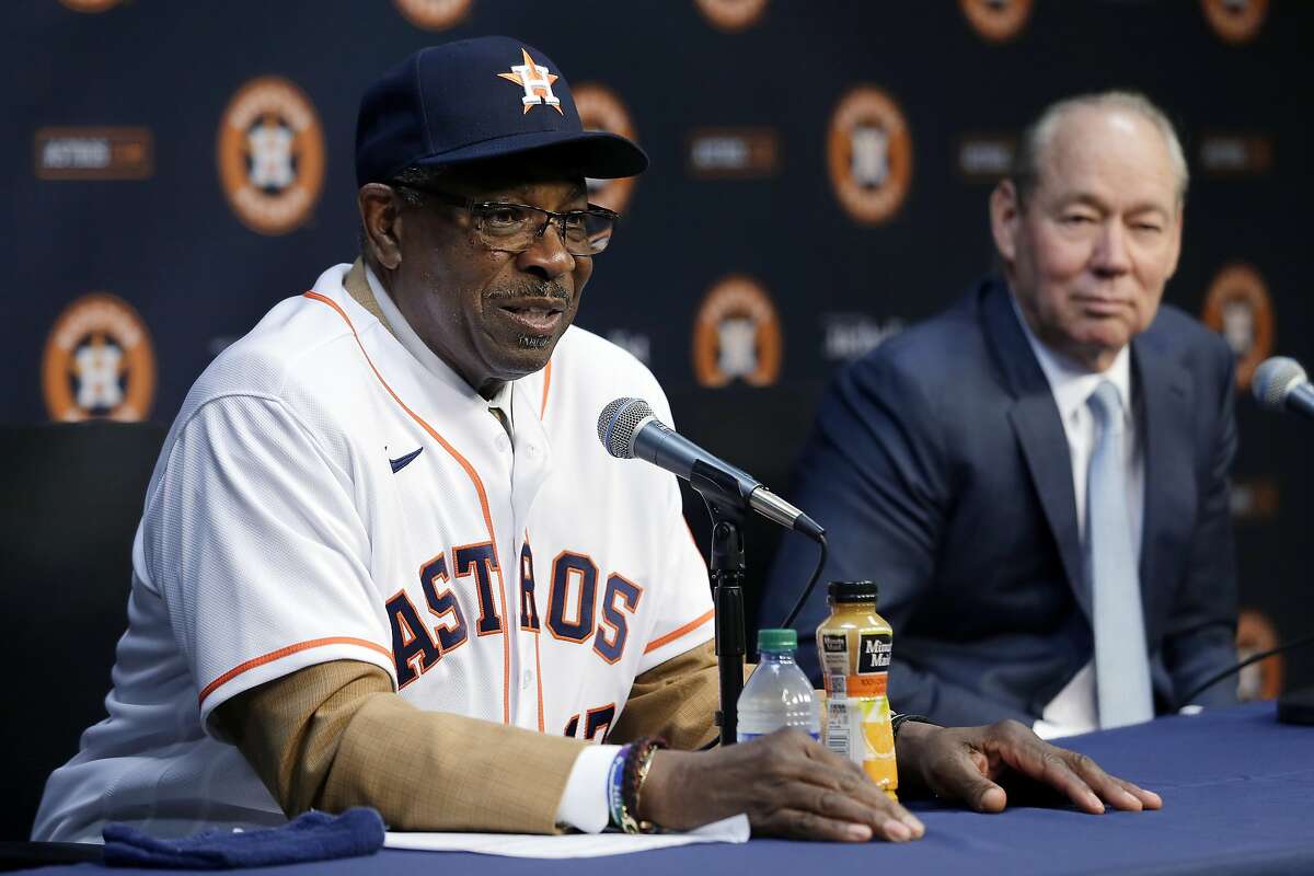 Dusty Baker, left, and team owner Jim Crane, right, speak during a press conference formally naming Baker as the new manager of the Houston Astros in the interview room at Minute Maid Park Thursday, Jan. 30, 2020, in Houston. (AP Photo/Michael Wyke)