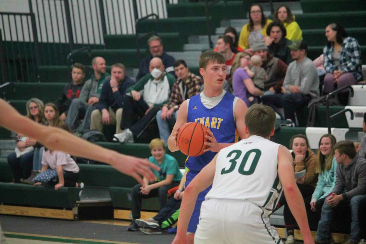 Evart basketball player Donavin Reagan (with ball) is among the top athletes for winter sports at his school. Evart and other area schools have been dealing with flu issues this season. (Herald Review file photo)