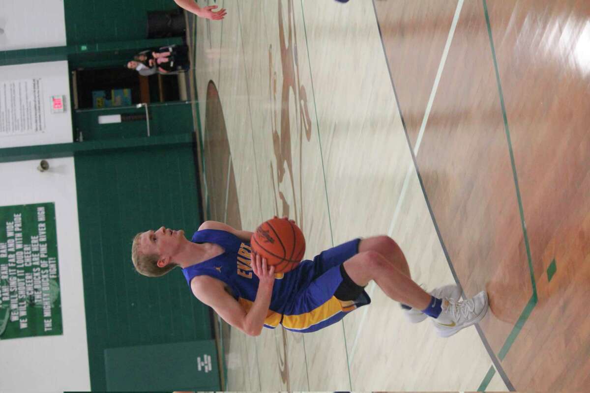 Evart's Cam Brasington looks to make a move in recent action. (Herald Review file photo)