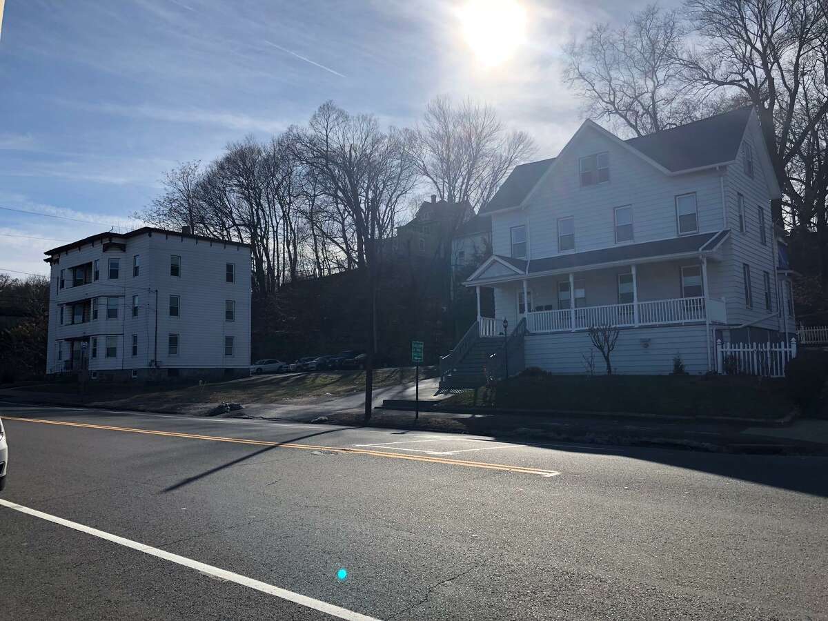 The city has proposed rezoning these three lots - the vacant one in the center is owned by the city - from a commercial district to residential.