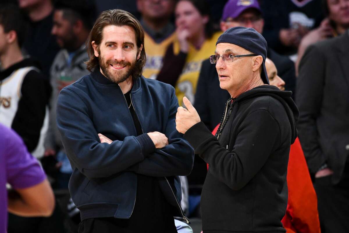 LOS ANGELES, CALIFORNIA - FEBRUARY 04: Jake Gyllenhaal (L) and Jimmy Iovine attend a basketball game between the Los Angeles Lakers and the San Antonio Spurs at Staples Center on February 04, 2020 in Los Angeles, California. (Photo by Allen Berezovsky/Getty Images)