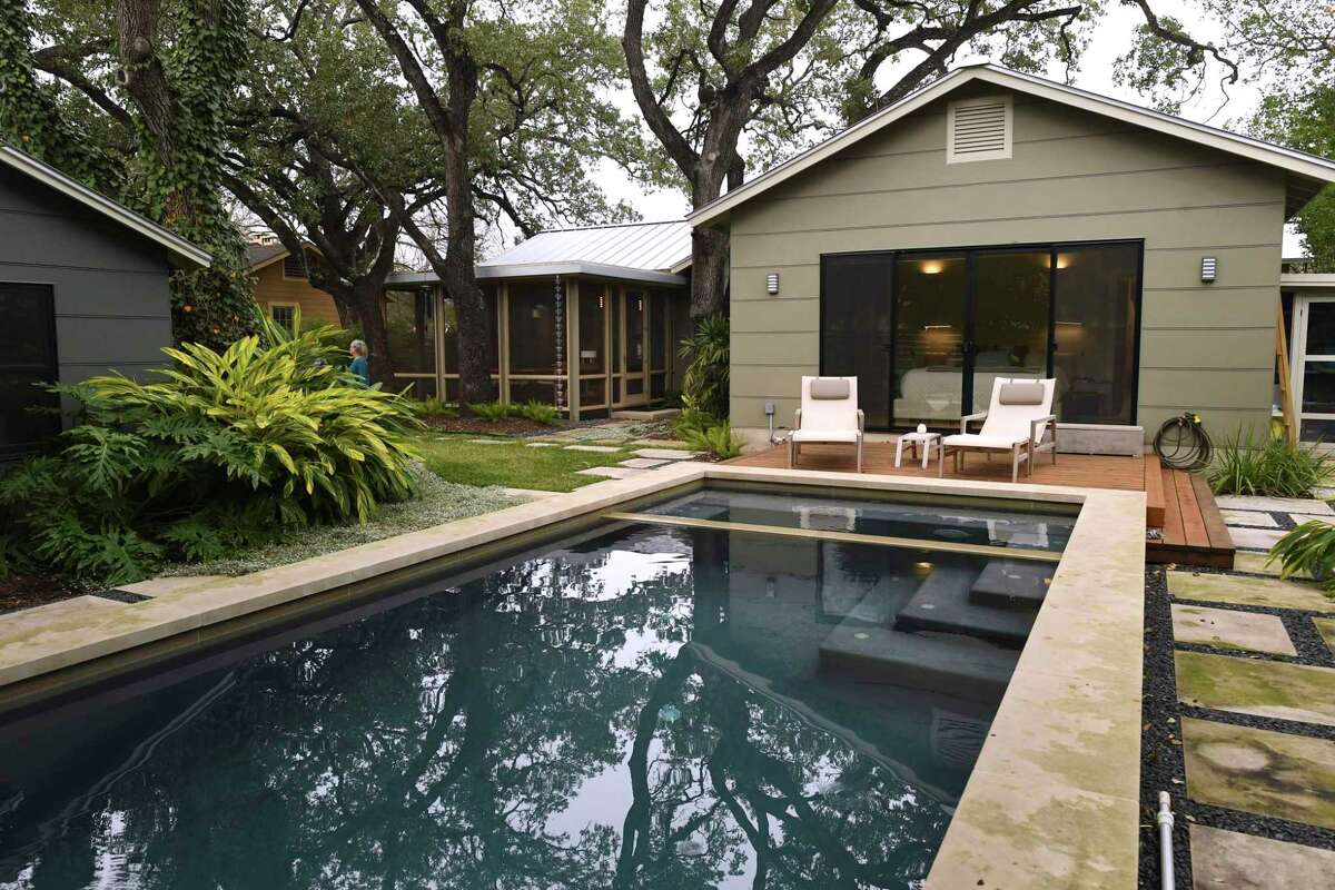 The Debra Maltz and Tonio Athens renovated their Alamo Heights home to make it more comfortable and serve them well as they age. Their backyard includes a swimming pool off the master bedroom and a handsome screened-in porch adjacent to the living room.