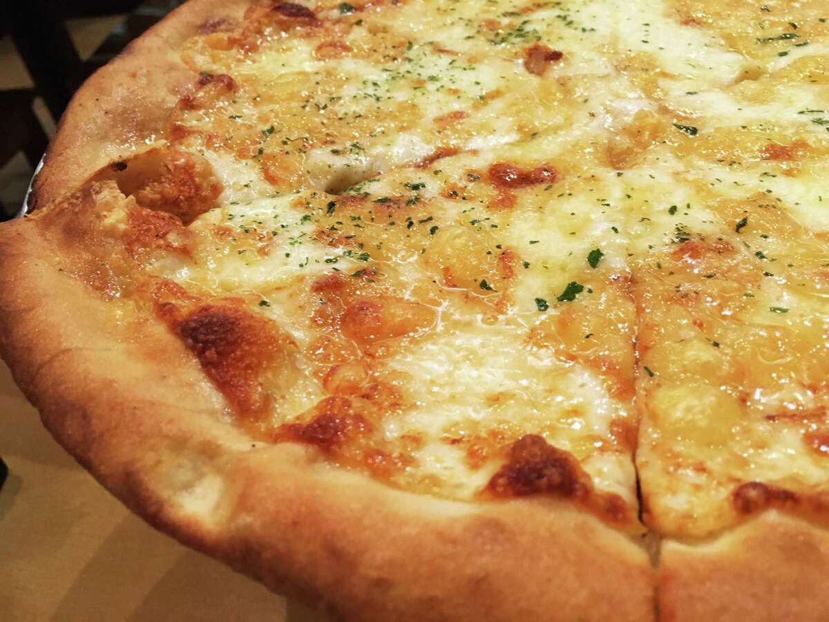 The four cheese pizza at Fratello's Italian Market & Deli is made with fontina, provolone, mozzarella and Parmigiano.