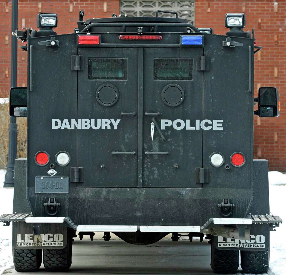 A Danbury Police Department Emergency Services Unit is parked next to Litchfield Hall during a Western Connecticut State University Police Department live shooting exercise with Danbury and other area police departments at the WCSU midtown campus Campus on Thursday, February 11, 2016, in Danbury, Conn. The training drill took place in the university's Litchfield Hall dormitory building.