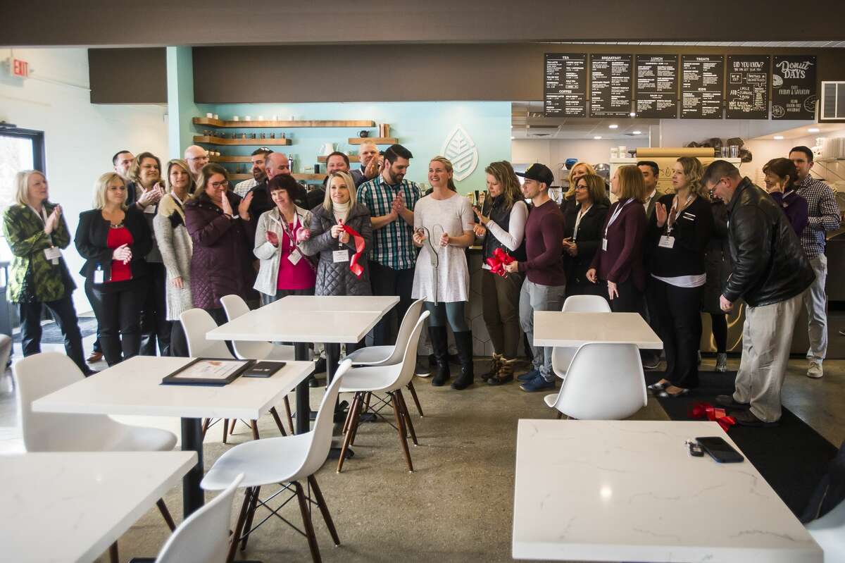 Grove Tea Lounge celebrates its one year anniversary with a ribbon cutting along with the Midland Business Alliance Tuesday, Feb. 4, 2020. (Katy Kildee/kkildee@mdn.net)
