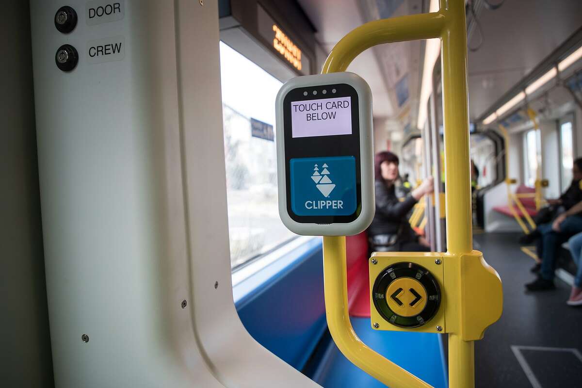 A Clipper card reader and manual door button on a new Muni Metro light rail car on Monday, March 12, 2018 in San Francisco, CA