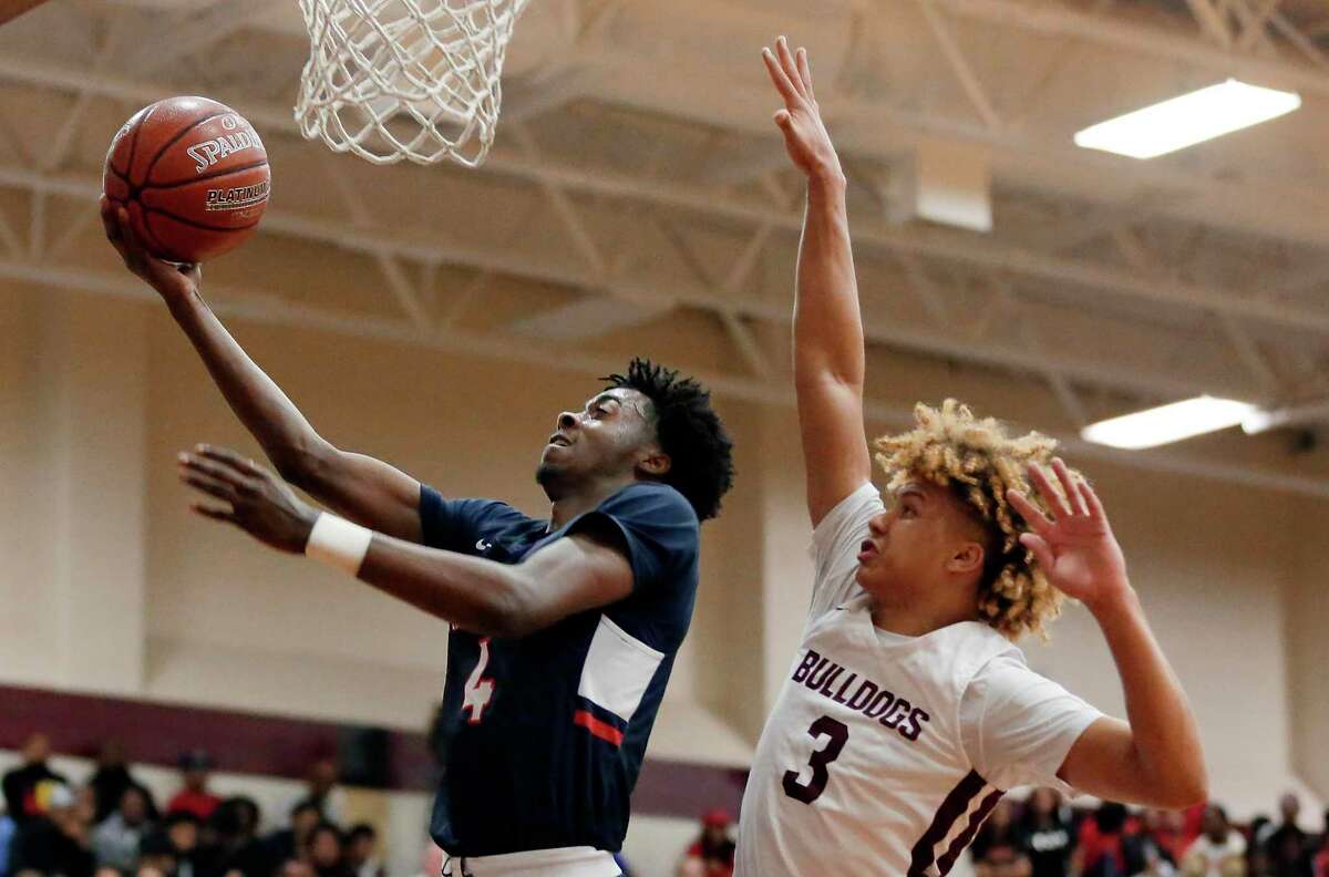 Atascocita guard Dylan Dawson (4) puts up a shot in front of Summer Creek JaVon Jackson (3) during the first half of a high school basketball game Tuesday, Feb. 4, 2020 in Houston, TX.