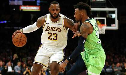Robert Covington (right) likely won’t be on hand to guard LeBron James on Thursday, but the long-armed and versatile defender is expected to be a fit in the Rockets’ switching style and defend bigger opponents.