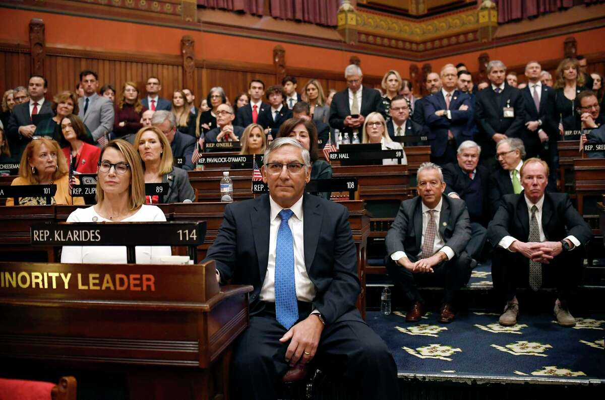 Connecticut House Minority Leader Themis Klarides, R-Derby, left, and Senate Minority Leader Len Fasano, R-North Haven, center, sit with Republicans as they listen to Gov. Ned Lamont deliver the State of the State during opening session at the State Capitol, Wednesday, Feb. 5, 2020, in Hartford, Conn. (AP Photo/Jessica Hill)