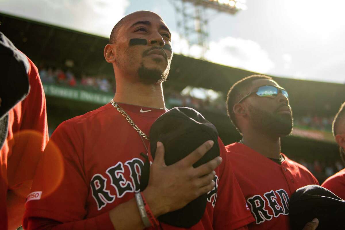 Red Sox outfielder Mookie Betts looks on before a game against the Baltimore Orioles on Sept. at Fenway Park in Boston. Betts was traded to the Dodgers late Tuesday night.