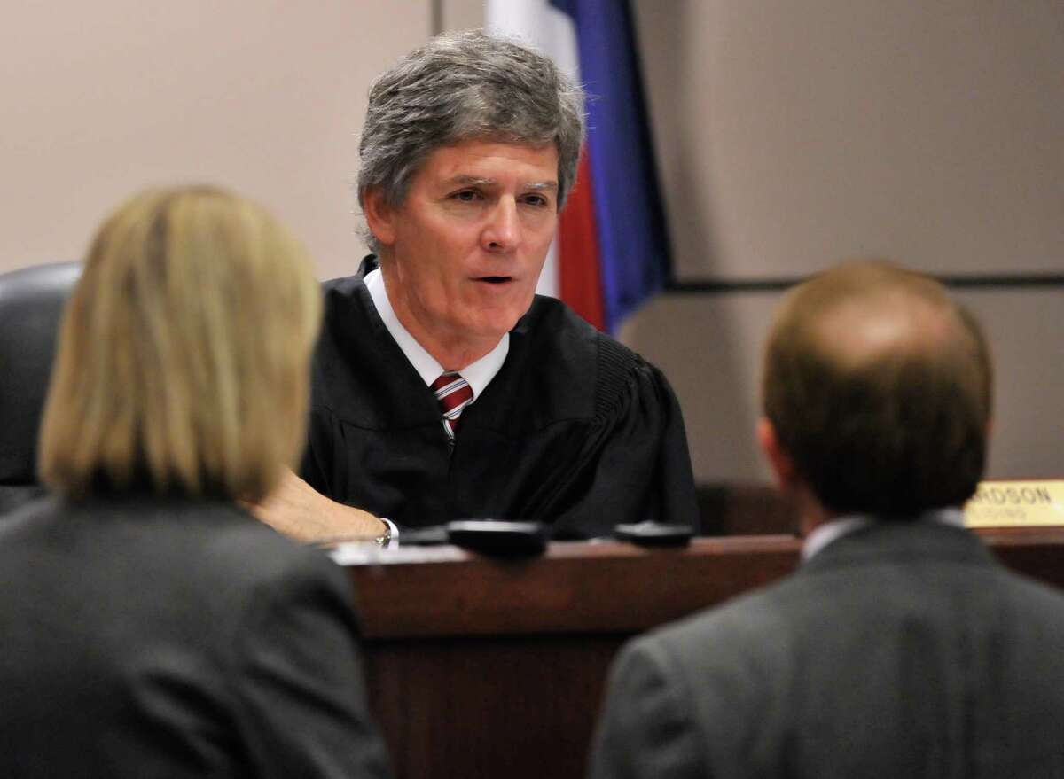 In this file photo, Judge Bert Richardson talks to prosecutors during a new trial hearing for a death row inmate. Richardson has served on Court of Criminal Appeals since winning election in 2014.