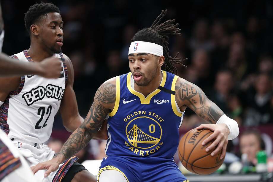 Golden State Warriors guard D'Angelo Russell (0) drives next to Brooklyn Nets guard Caris LeVert (22) during the first half of an NBA basketball game Wednesday, Feb. 5, 2020, in New York. (AP Photo/Kathy Willens) Photo: Kathy Willens / Associated Press